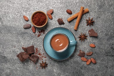 Flat lay composition with yummy hot chocolate on grey table