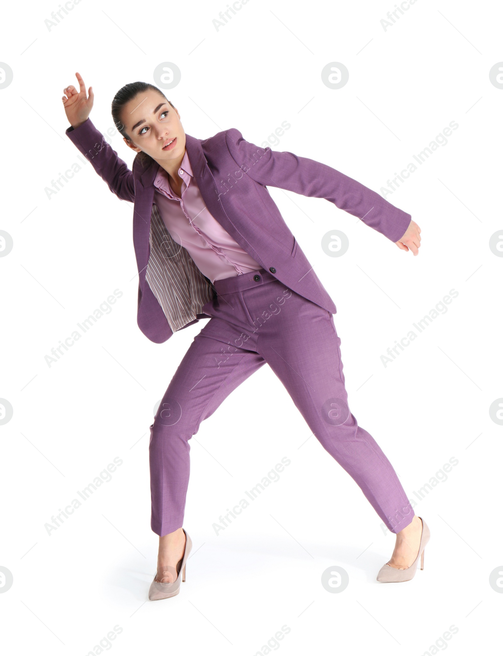 Photo of Businesswoman attracted to magnet on white background