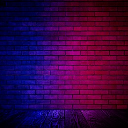 Image of Room with brick wall and wooden floor in neon lights