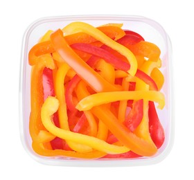 Fresh cut bell peppers in plastic container isolated on white, top view