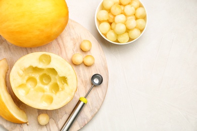 Photo of Flat lay composition with melon balls on light background, space for text