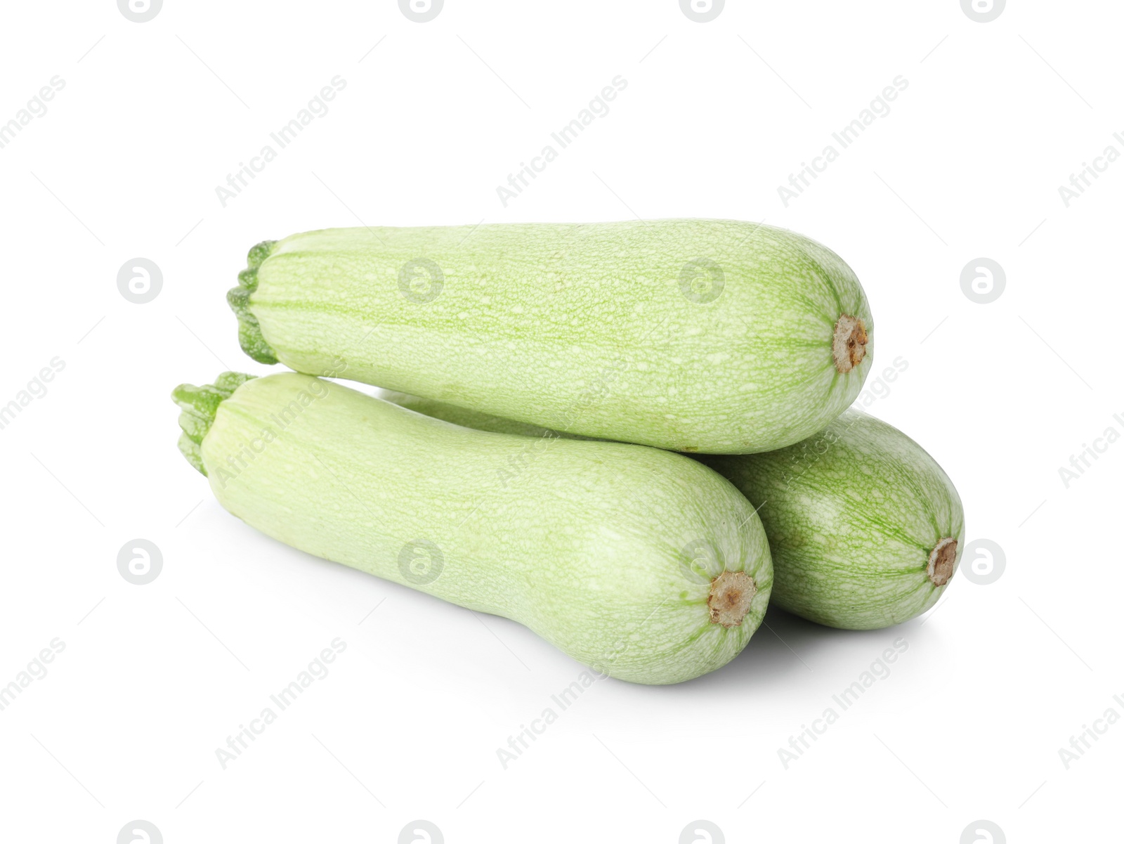 Photo of Raw green ripe zucchinis isolated on white