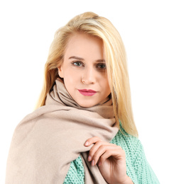 Pretty young woman wearing warm sweater and scarf on white background