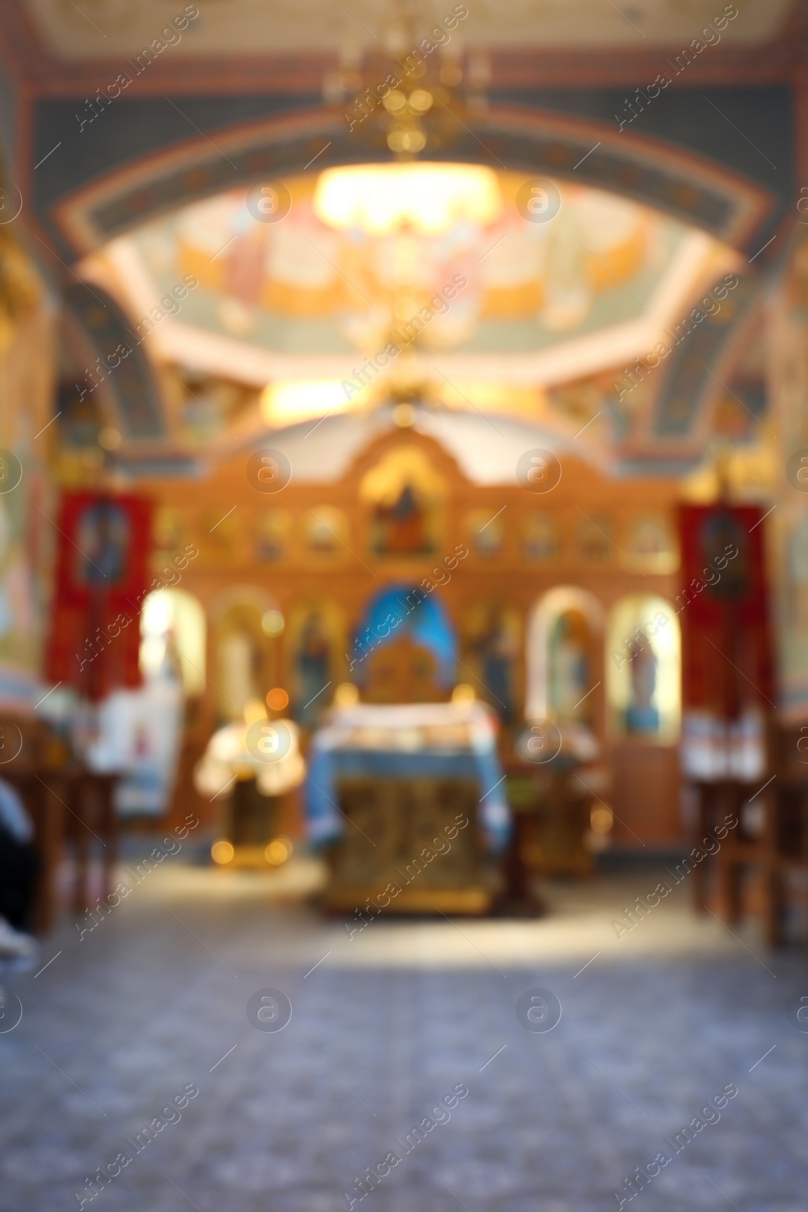 Photo of Blurred view of beautiful church interior with ecclesiastical icons