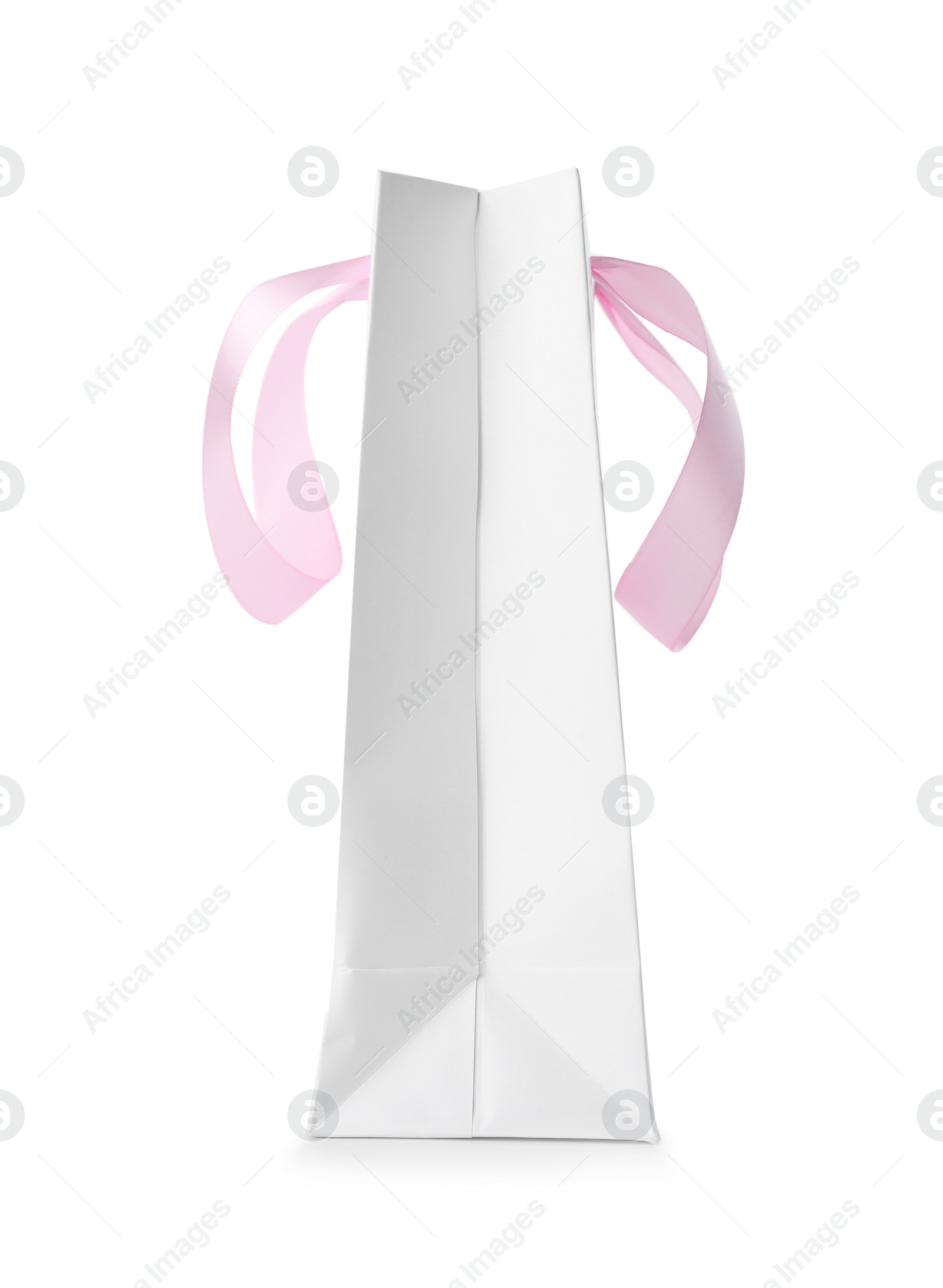 Photo of Paper shopping bag with ribbon handles on white background