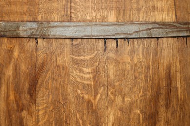 Traditional wooden barrel as background, closeup. Wine making