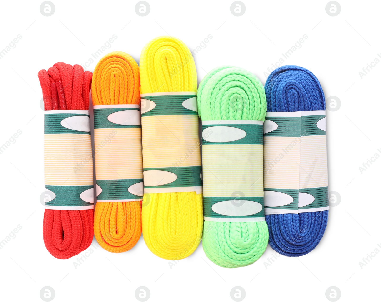 Photo of Packed colorful shoe laces on white background, top view