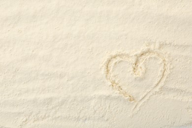 Photo of Heart drawn on baking powder, top view. Space for text