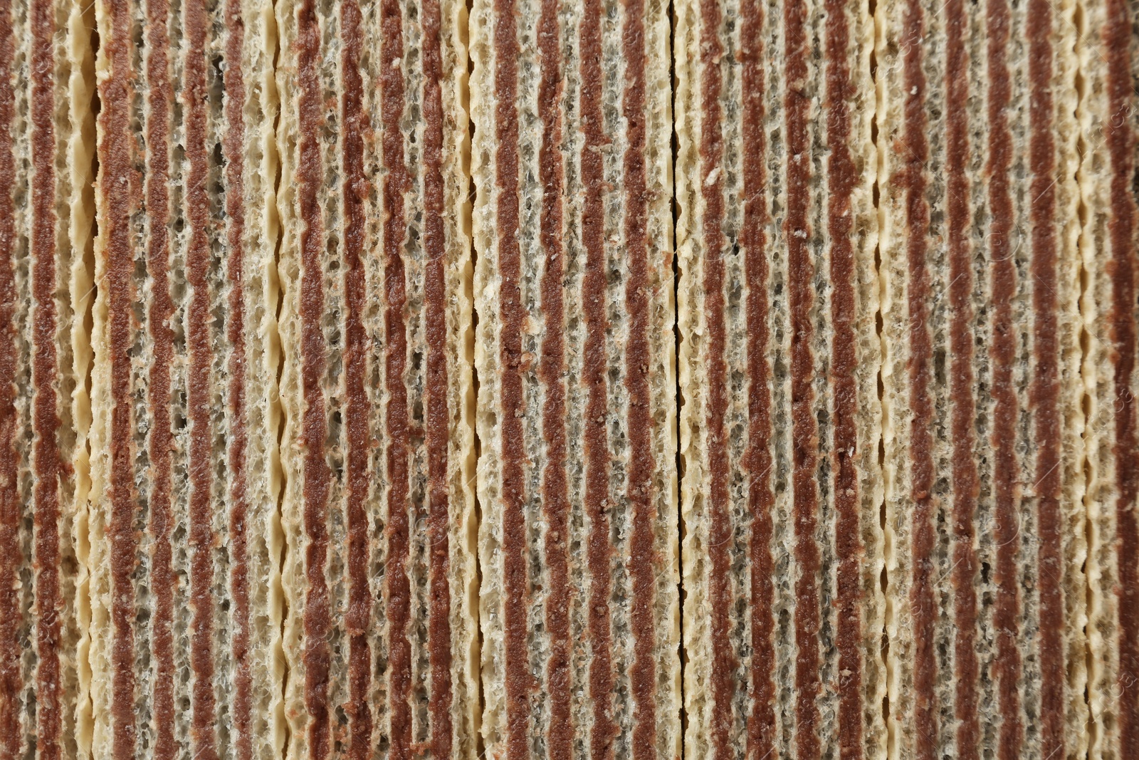 Photo of Closeup view of tasty wafer sticks as background. Sweet food