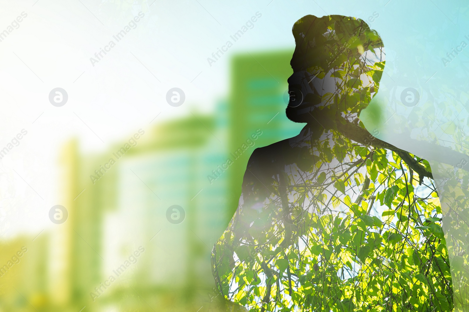 Image of Double exposure of man and green tree in city