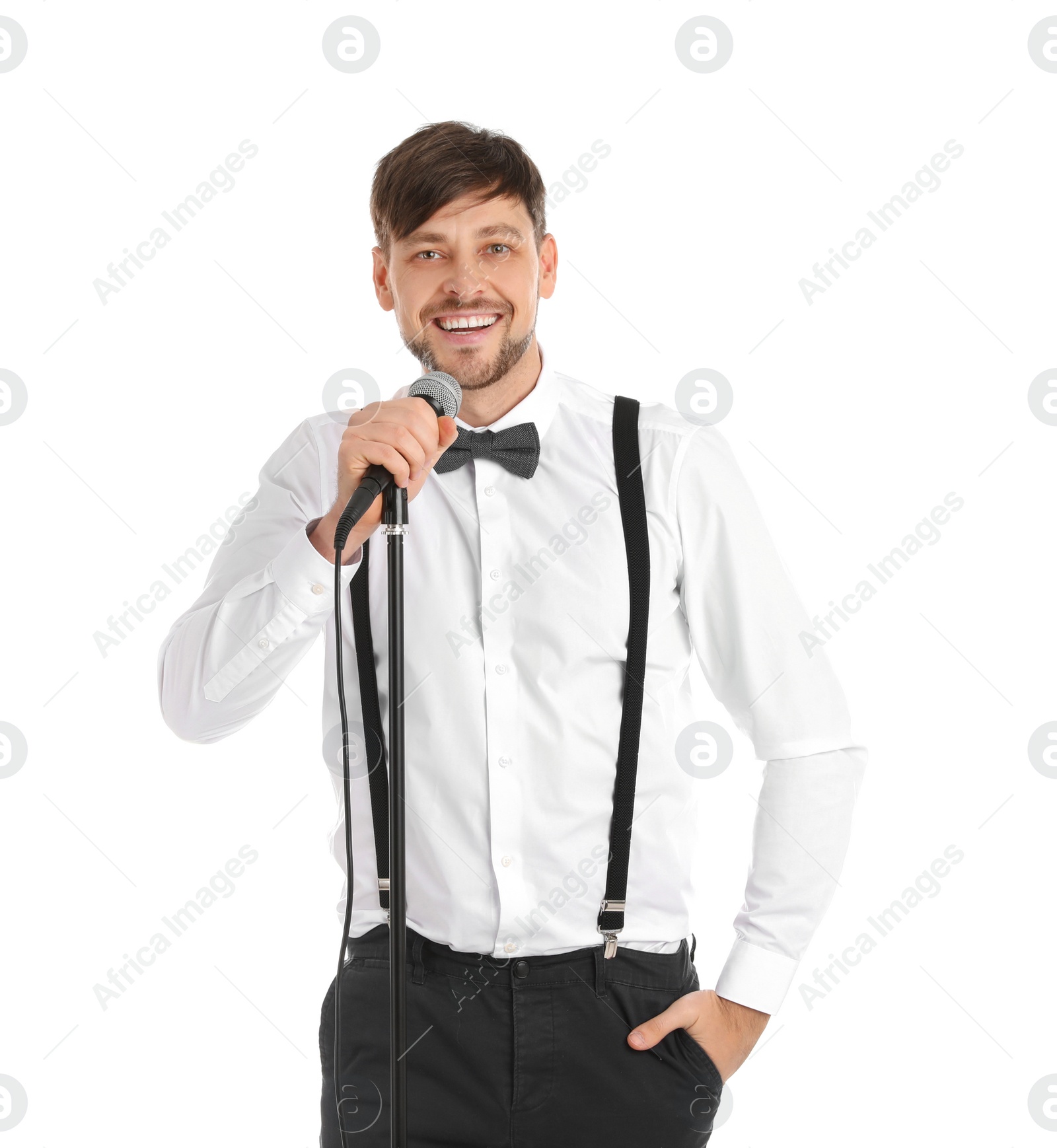 Photo of Handsome man in formal clothes posing with microphone on white background