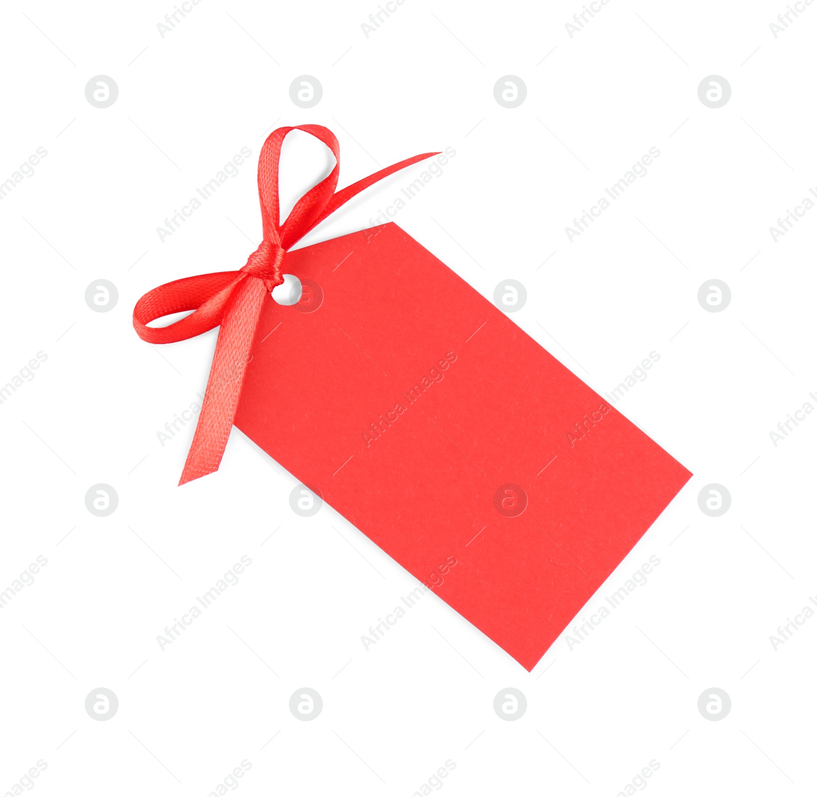 Photo of Blank red gift tag with satin ribbon on white background, top view