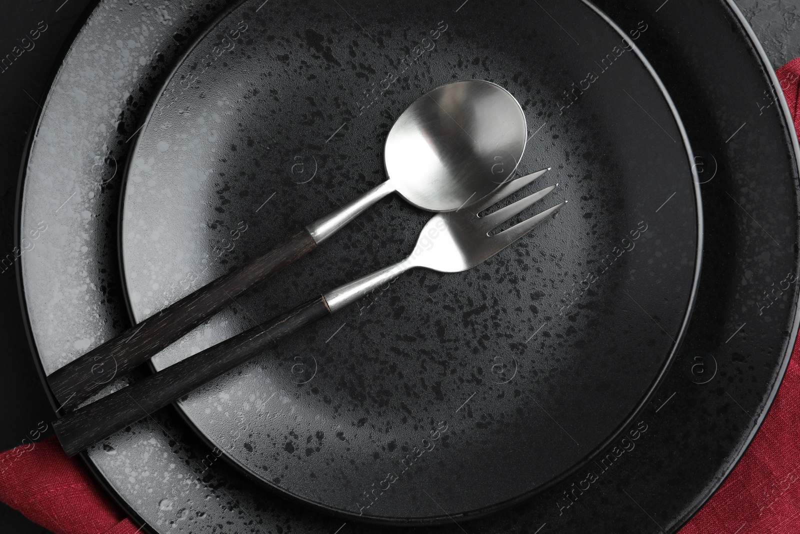 Photo of Stylish setting with cutlery and plates on table, top view