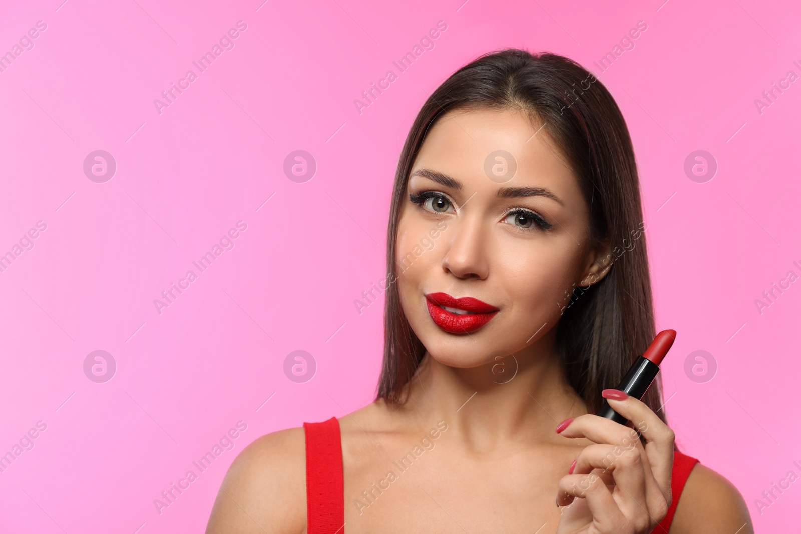 Photo of Beautiful woman with red lipstick on pink background, space for text