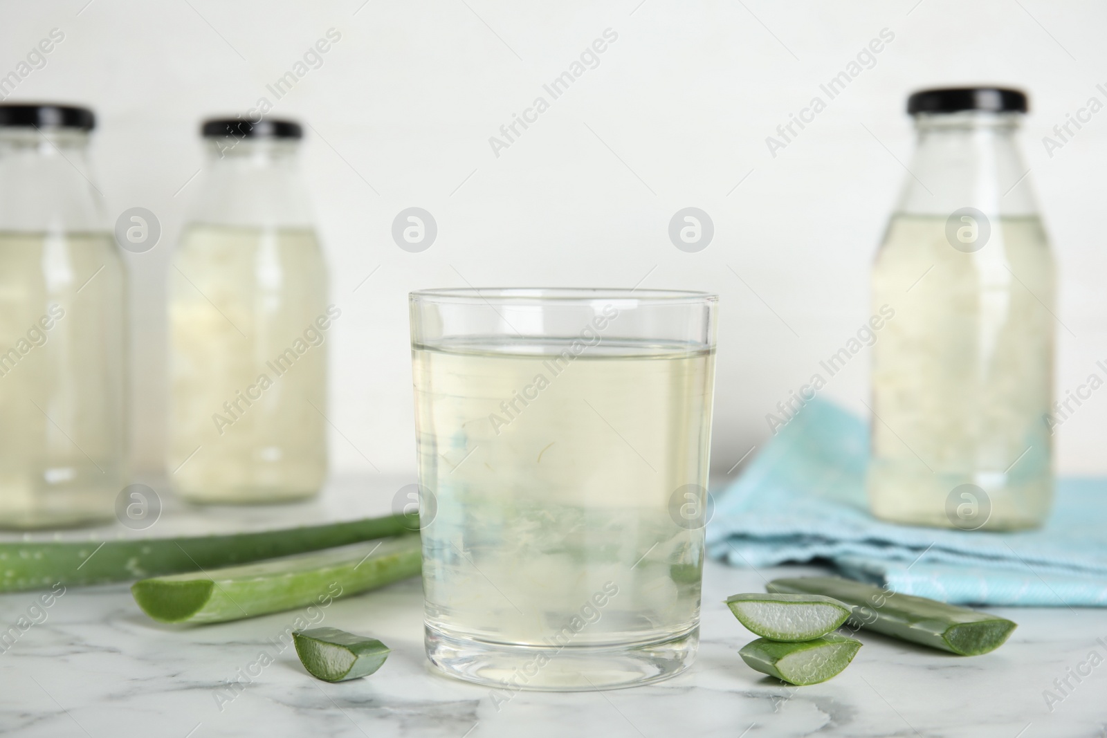 Photo of Fresh aloe drink on white marble table