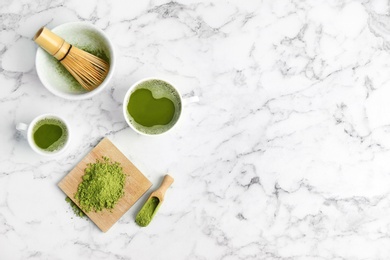 Flat lay composition with matcha tea on marble background