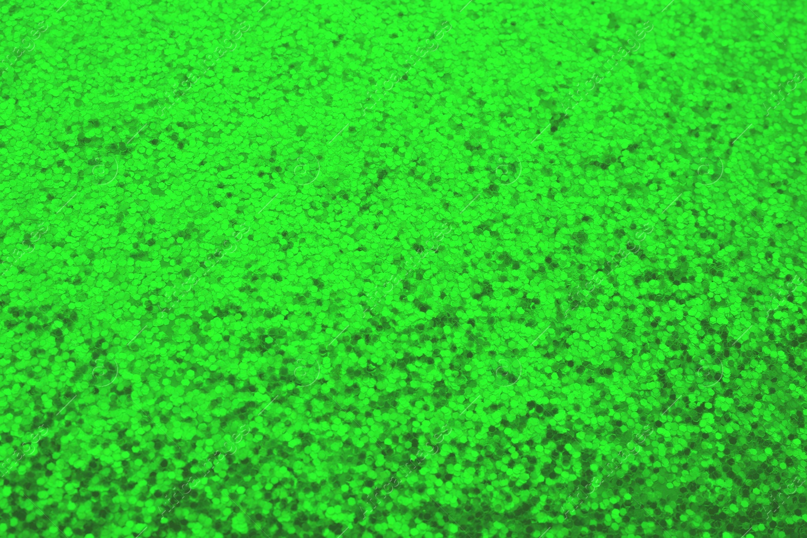 Image of St. Patrick day. Green glitter as background, closeup