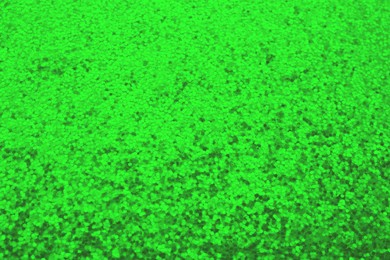 Image of St. Patrick day. Green glitter as background, closeup