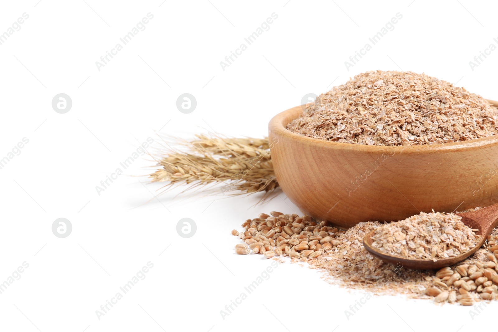 Photo of Wheat bran and spikelets on white background
