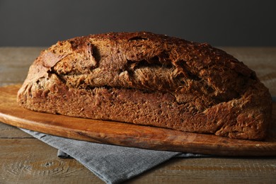 Photo of Freshly baked sourdough bread on wooden table