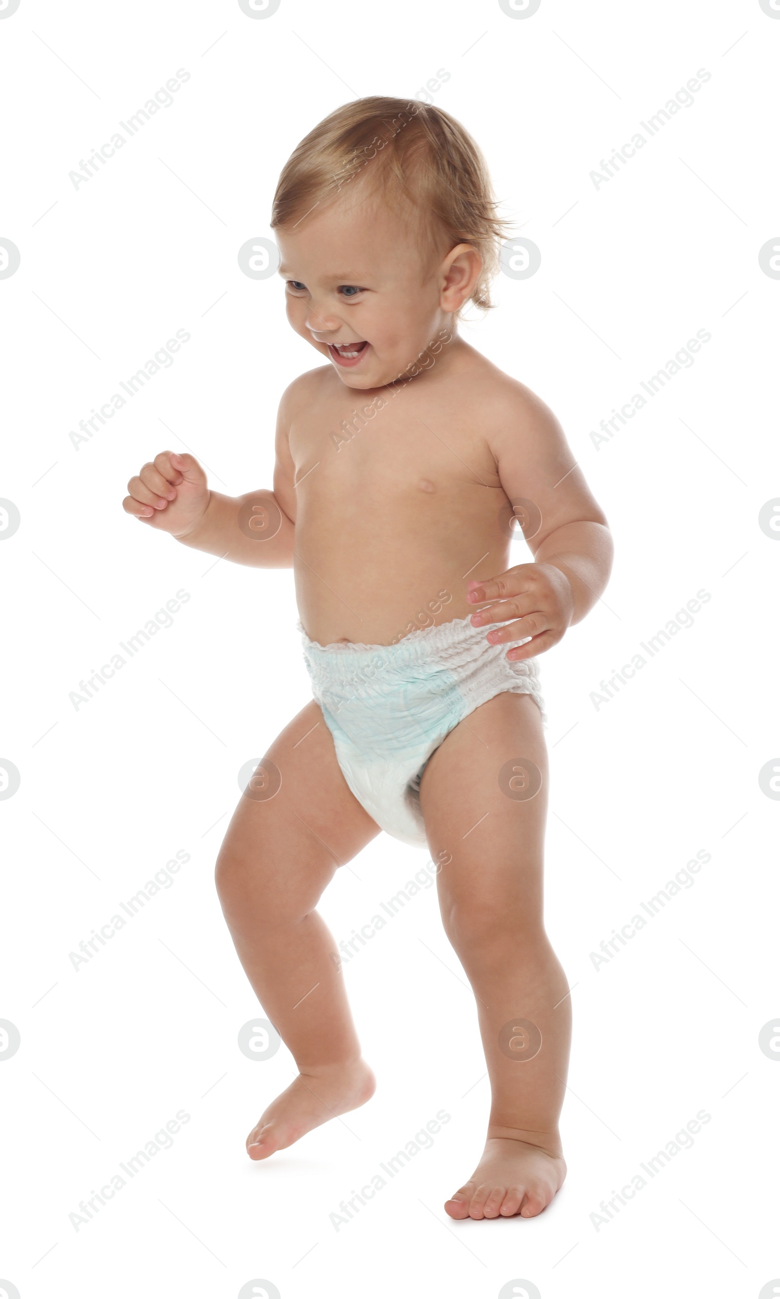 Photo of Cute baby in diaper learning to walk on white background