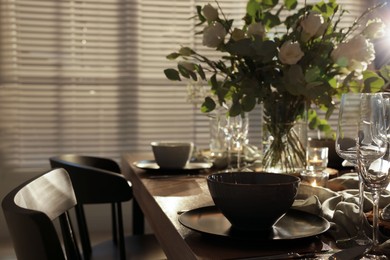 Festive table setting with beautiful tableware and decor indoors