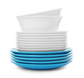 Stack of clean plates and bowls on white background. Washing dishes