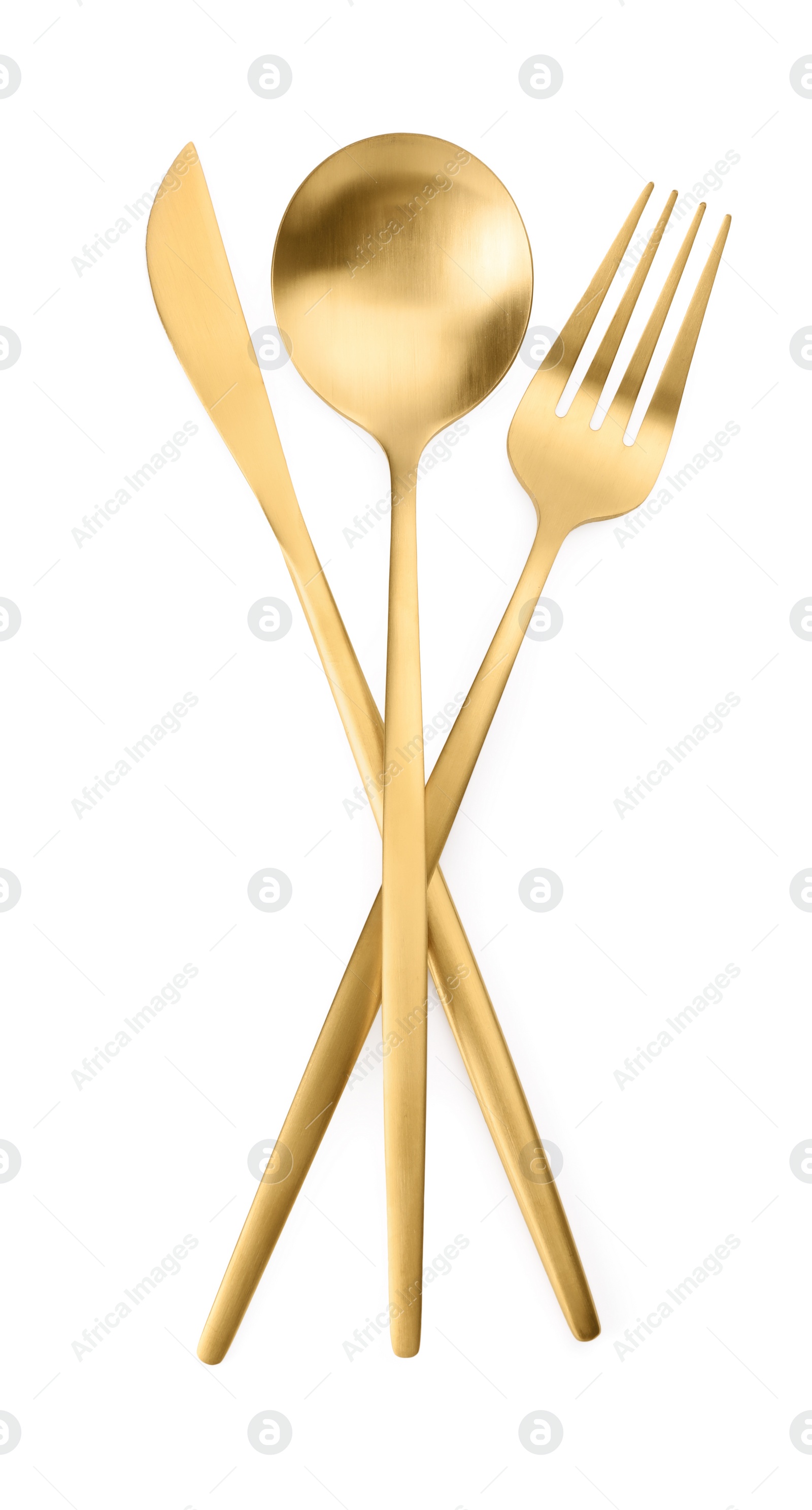 Photo of Shiny golden fork, spoon and knife isolated on white, top view. Luxury cutlery set