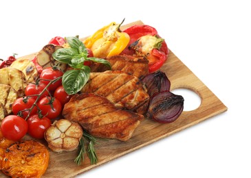 Wooden board with tasty grilled vegetables, meat, rosemary and basil isolated on white