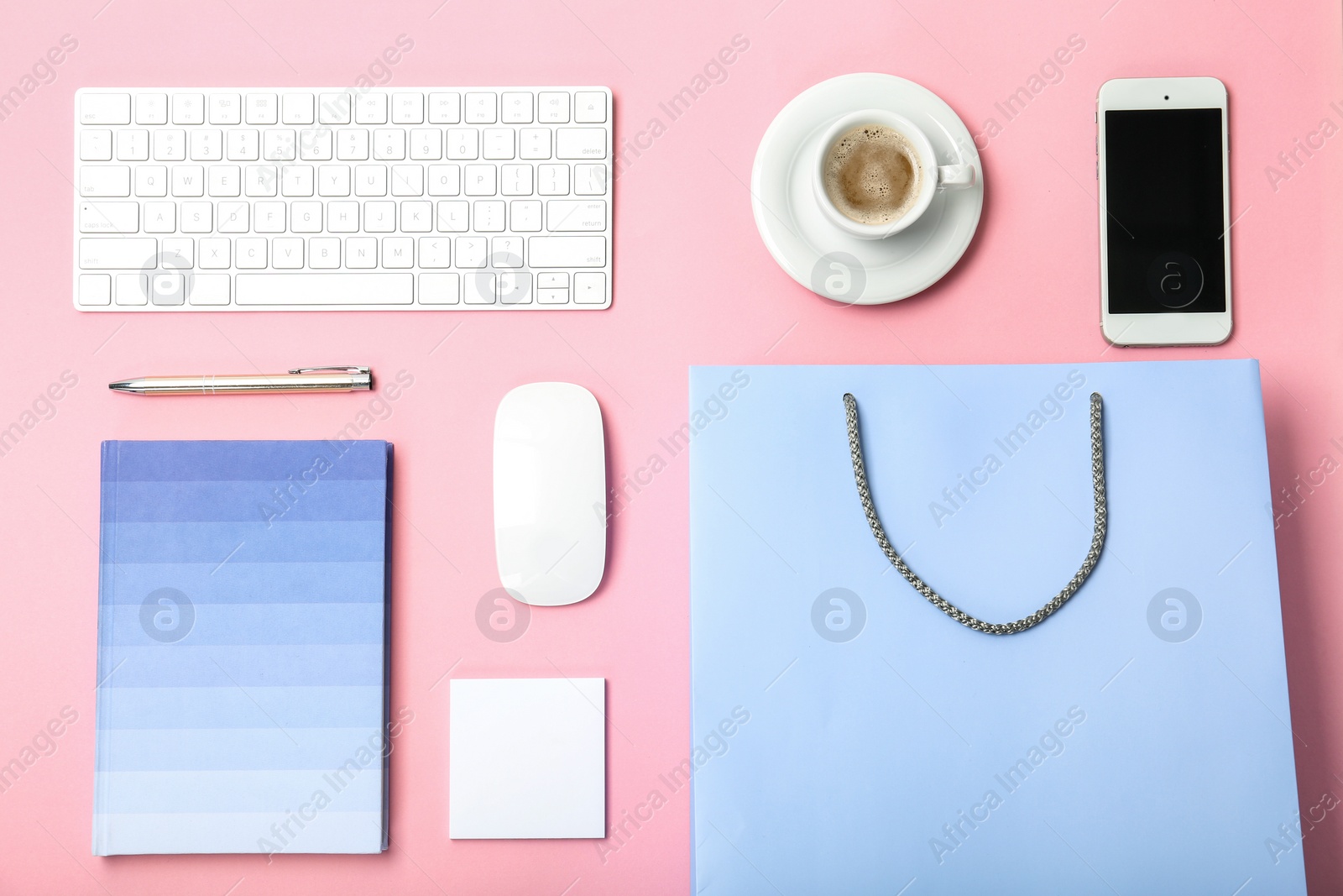 Photo of Stylish flat lay composition with shopping bag on color background