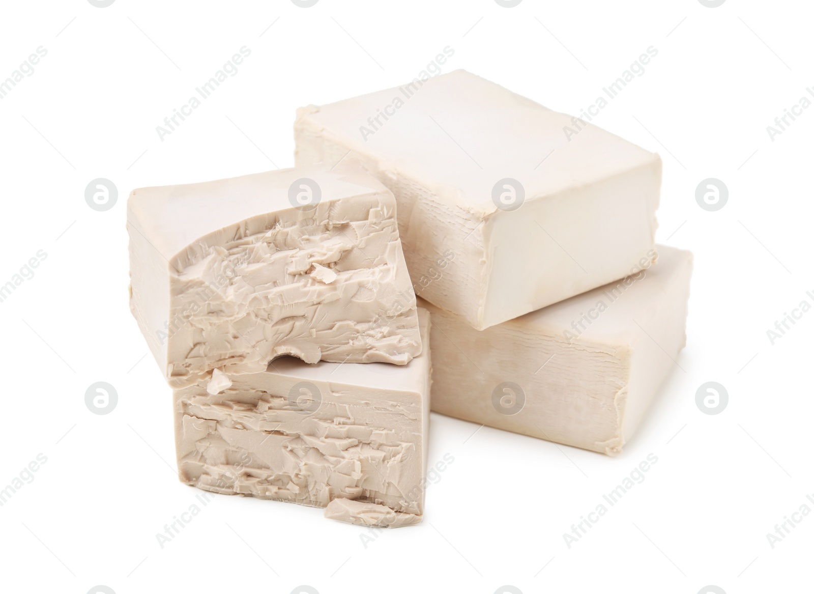 Photo of Blocks of compressed yeast on white background