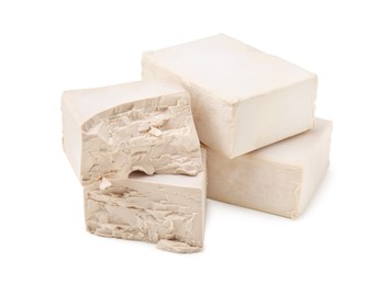Photo of Blocks of compressed yeast on white background