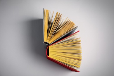 Photo of Hardcover books on grey background, flat lay