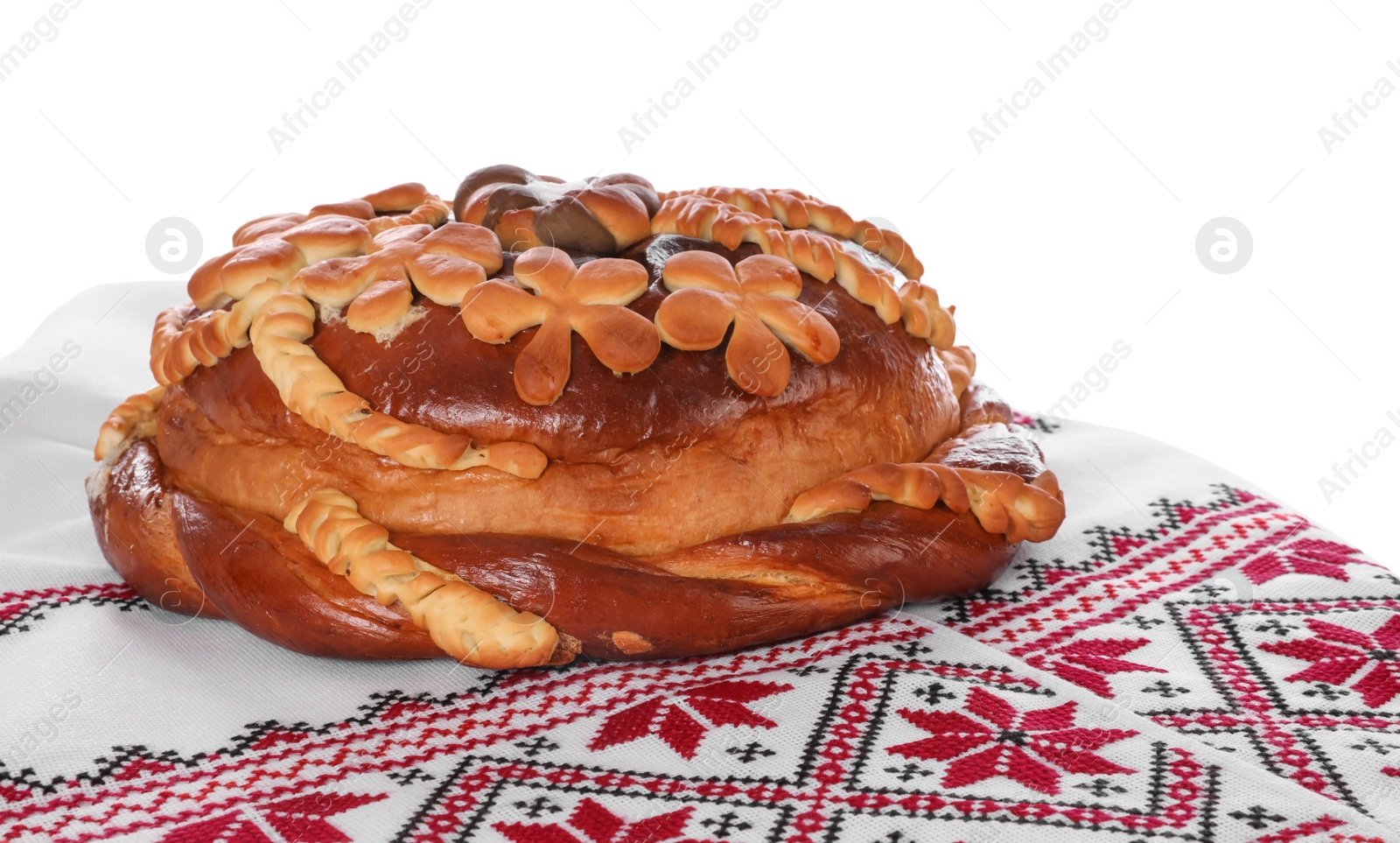 Photo of Rushnyk with korovai on white background. Ukrainian bread and salt welcoming tradition