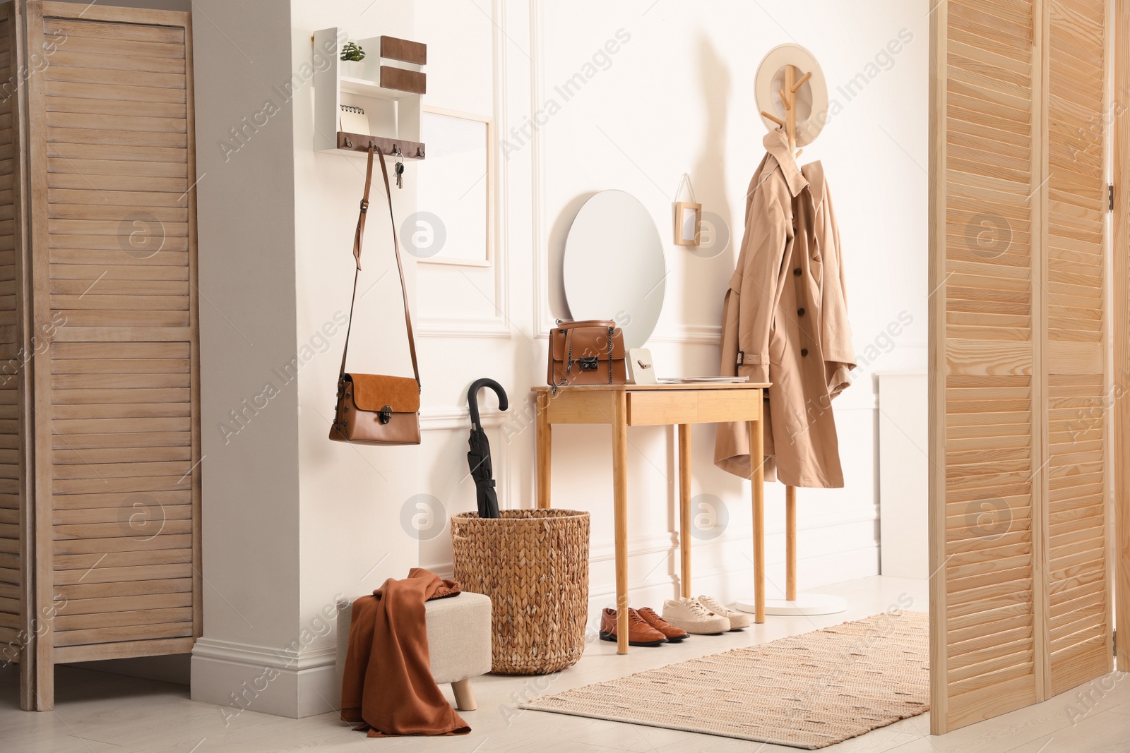 Photo of Modern hallway interior with stylish dressing table and key holder