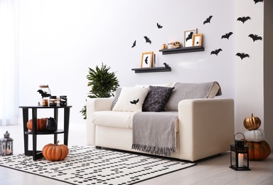 Photo of Modern room decorated for Halloween. Idea for festive interior