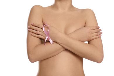 Photo of Naked woman with pink ribbon on white background, closeup. Breast cancer awareness