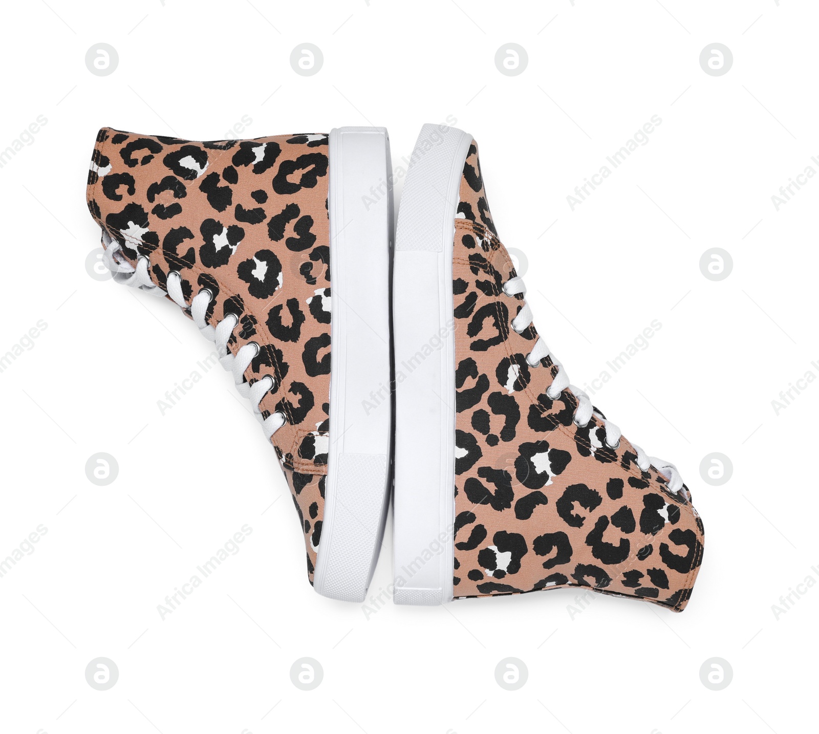 Photo of Pair of classic old school sneakers with leopard print isolated on white, top view