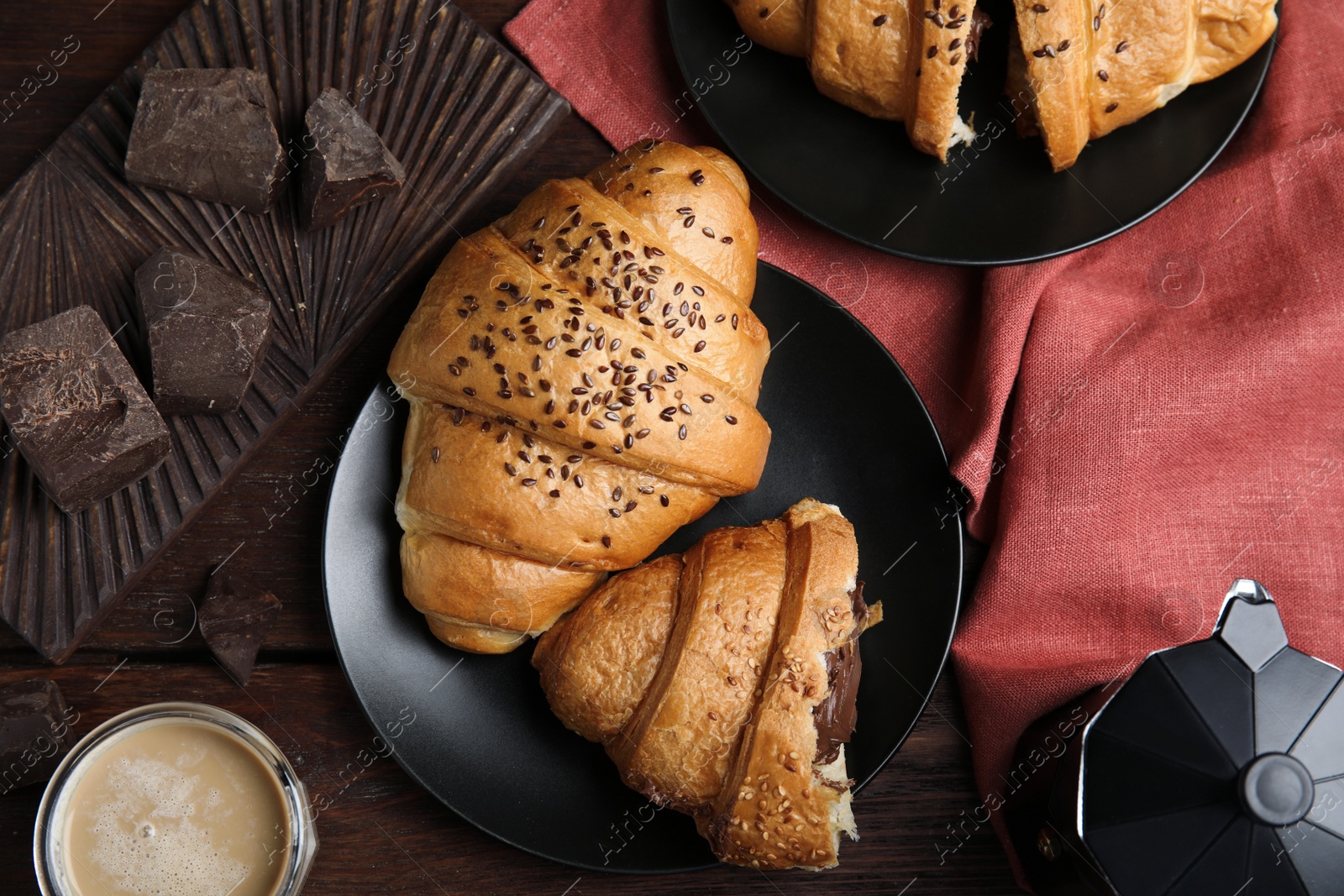 Photo of Flat lay composition with tasty croissants, chocolate and coffee on wooden table