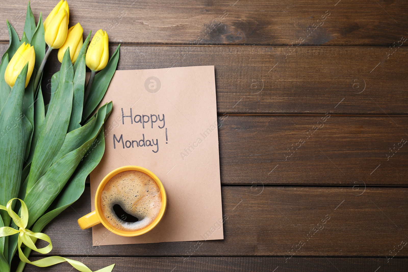Photo of Happy Monday message, aromatic coffee and tulips on wooden table, flat lay. Space for text