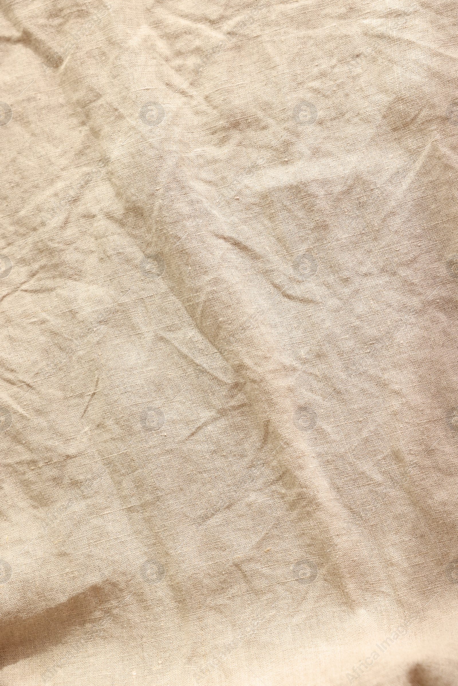 Photo of Beautiful beige fabric as background, top view