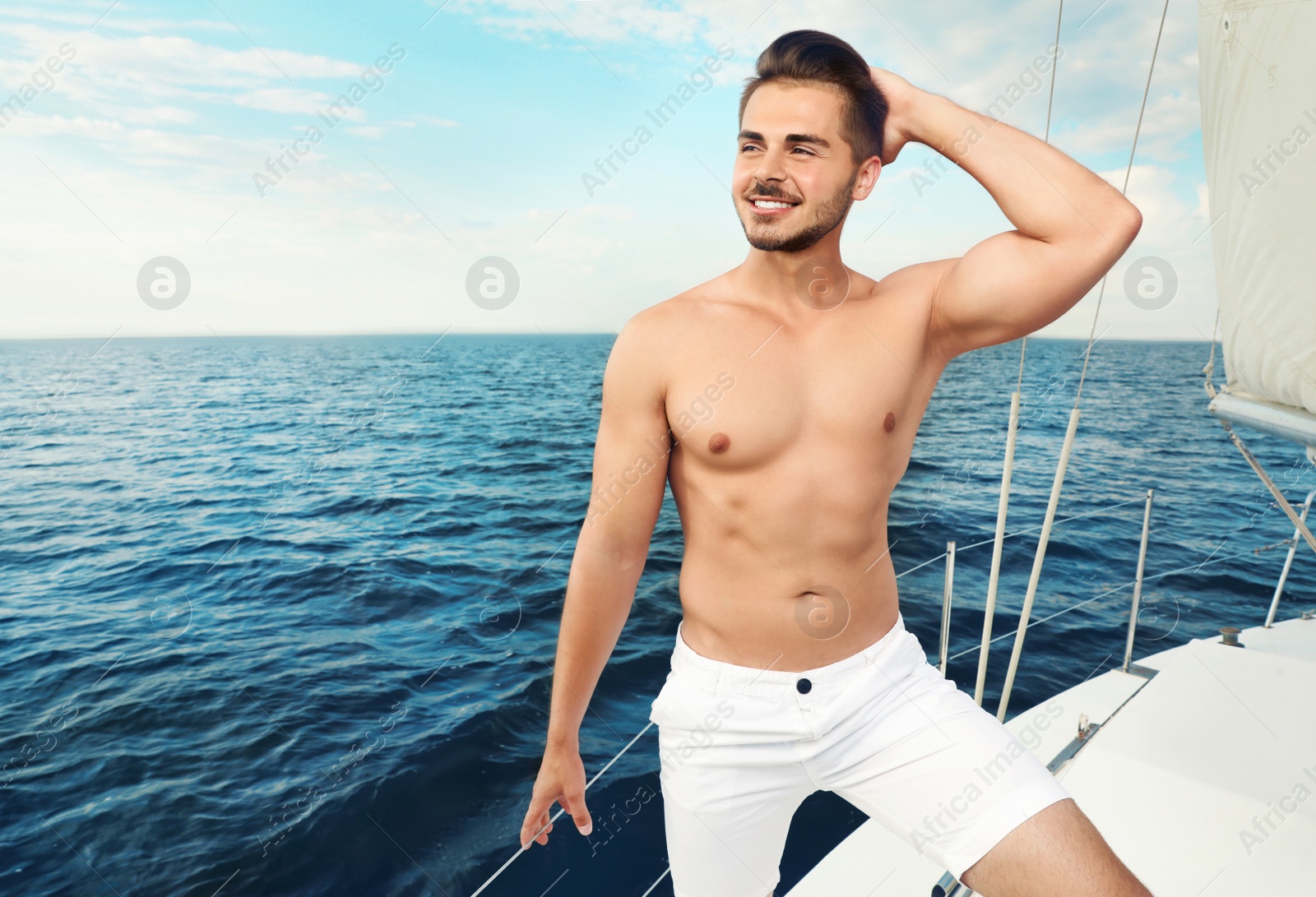 Photo of Young man resting on yacht at sea