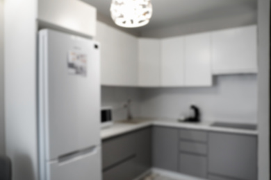 Blurred view of stylish modern kitchen interior