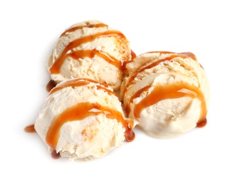 Photo of Tasty ice cream with caramel sauce on white background