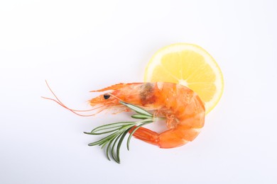 Photo of Delicious cooked shrimp, lemon and rosemary isolated on white, top view