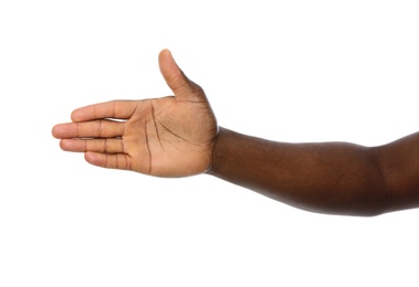 Photo of African-American man extending hand for shake on white background, closeup