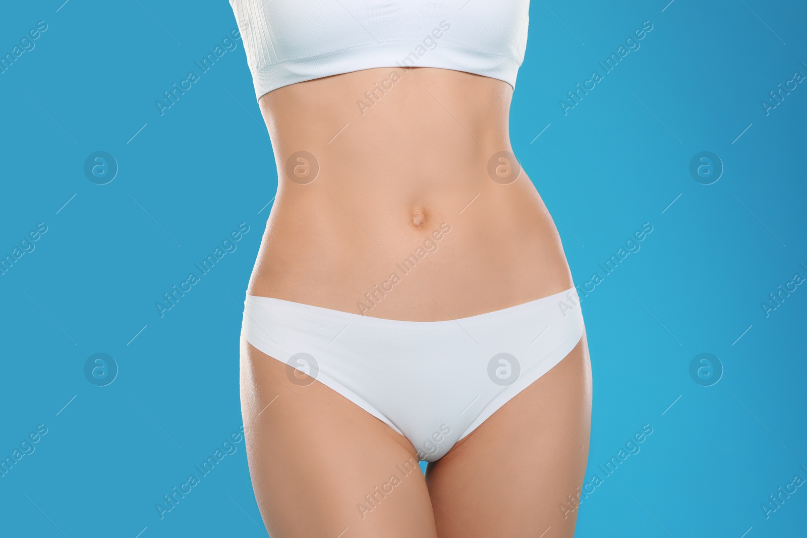 Photo of Slim young woman with smooth gentle skin on color background, closeup. Beauty and body care concept