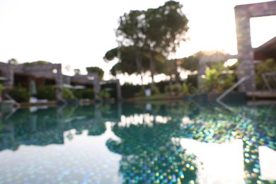 Outdoor swimming pool at resort, blurred view