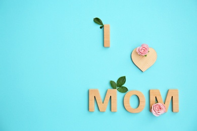 Photo of Phrase "I LOVE MOM" made of letters on color background. Happy Mother's Day