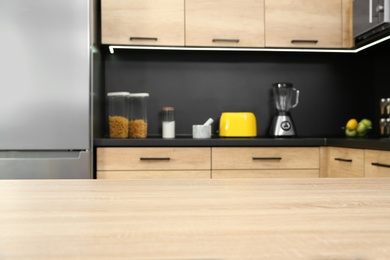 Photo of Countertop and blurred view of kitchen interior on background